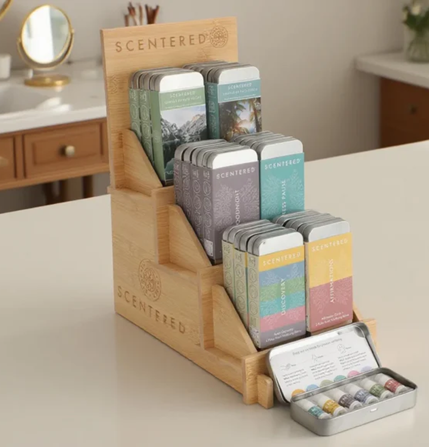 Scentered® branded wooden display stand featuring aromatherapy balm tins