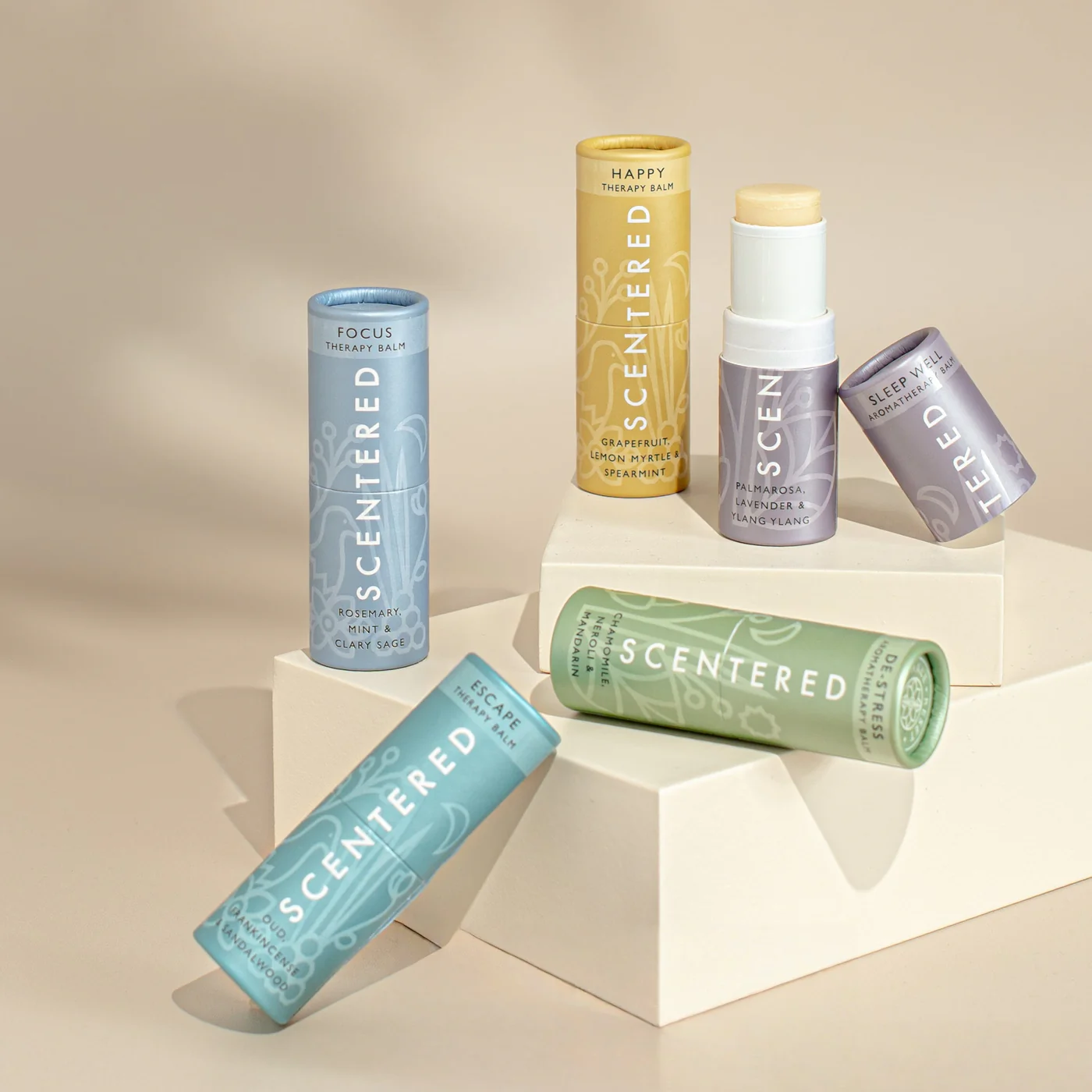 Scentered® aromatherapy balms displayed on geometric blocks